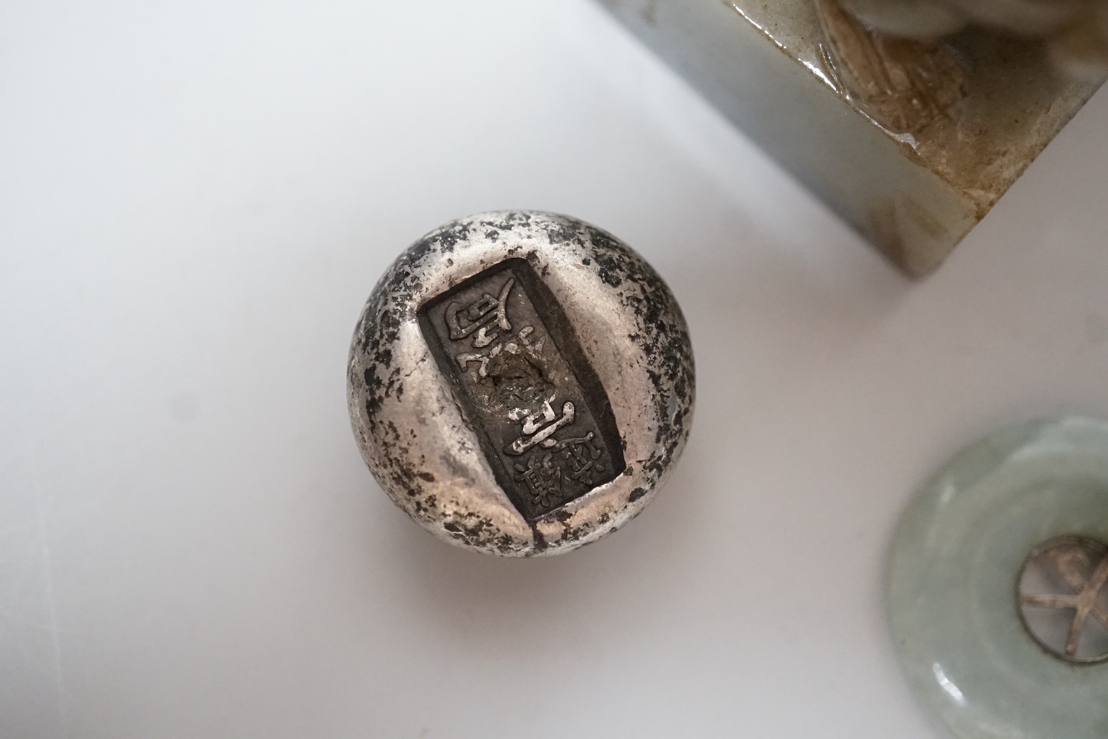 A Chinese jadeite lion-dog seal (black matrix), a similar pendant and two ingots